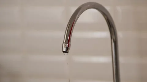Close Up of Water Drops Dripping from an Open Faucet Stock Footage 331531364