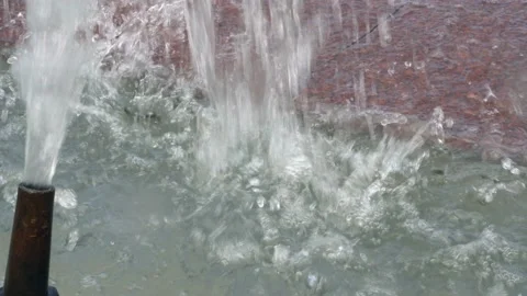 Close-up of water drops falling on the granite stone in the city fountain. 스톡 동영상 111702849