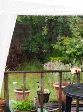 Close up of water drops falling from a white gazebo, Stock Photos