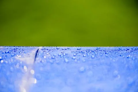 Close up Water drops pattern over a blue waterproof cloth background. World W Foto stock