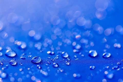 Close up Water drops pattern over a blue waterproof cloth background. World W 写真素材