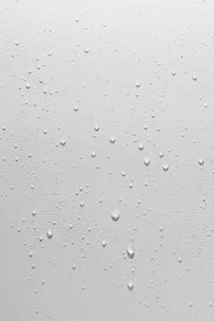 Close up of water drops on white background. Stock Photos