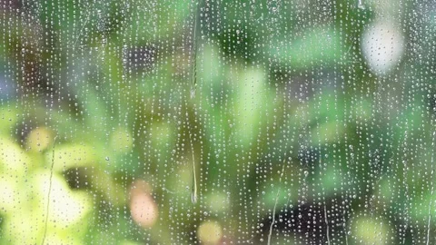 Close up Water Drops on window Glass on a rainy day, Water droplets on frosted g Stock Footage 221541112