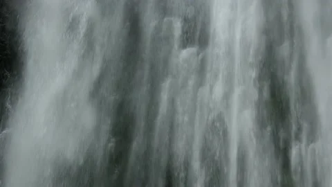 Close up of water falling on the cliff edge Stock Footage 163982590