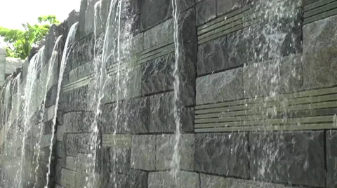 Close up water falling down  a stone water feature Stock Footage 39461704