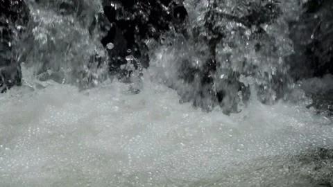 Close up of water falling through a rocky river cascade. Stock Footage 297651001