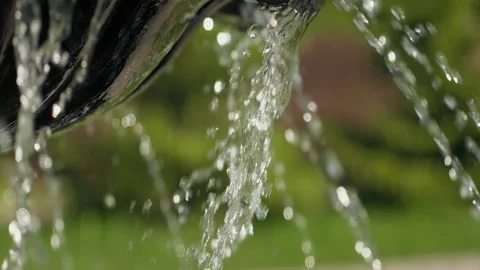 Close up on the water falling from the working fountain in the countryside Stock Footage 148731978