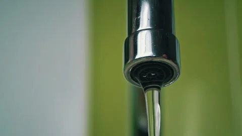 Close-up of Water Flowing From a Kitchen Faucet Video stock 252126366