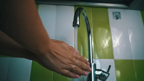 Close-up of Water Flowing From a Kitchen Faucet Stock Footage 252175761