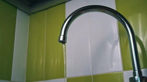 Close-up of Water Flowing From a Kitchen Faucet Stock Footage 252176001