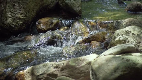 Close Up of Water Flowing over Rocks Video stock 84146849