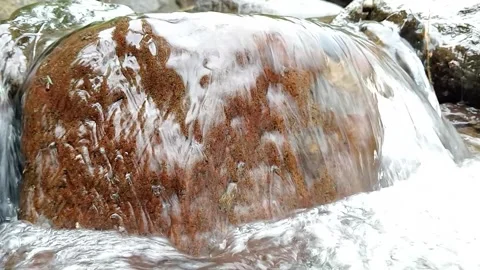 Close-Up of Water Flowing Over Rocks – Natural Stream Detail Stock Footage 330547864