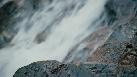 Close up Water Flowing Pass Texture of Rock and Strong Flowing Waterfall Stock Footage 154017038