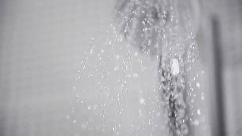 Close-up of water flowing from the shower head in bathroom falling water drops Stock Footage 106092559