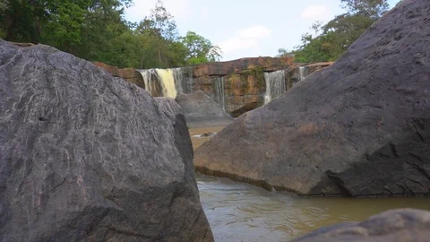 Close up water flowing on stone is waterfall in beautiful nature Video stock 123976972