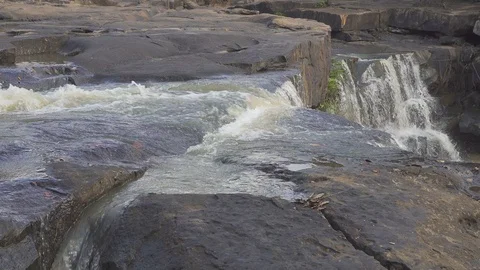 Close up water flowing on stone is waterfall in beautiful nature Video stock 123977387