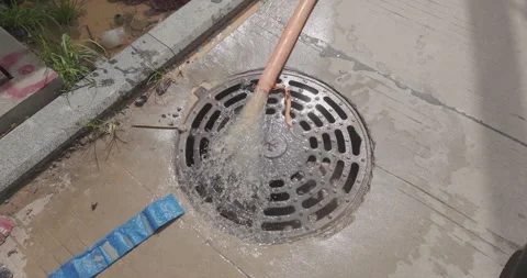 Close-up of water flowing into storm drain. Stock Footage 340540914