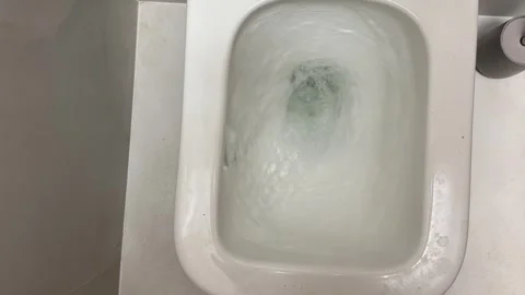 Close-up of water flushing in a toilet Stock Footage 330172296