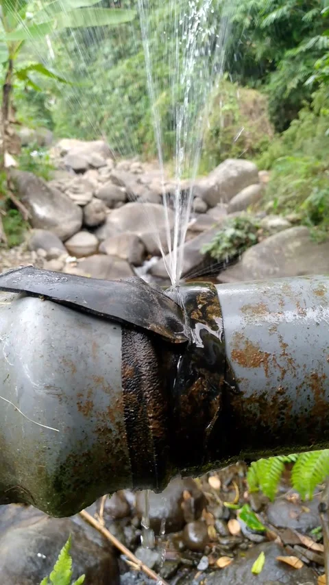 Close Up Water Gushing From Broken Pipe in Forest 4K Stock-Footage 342000324