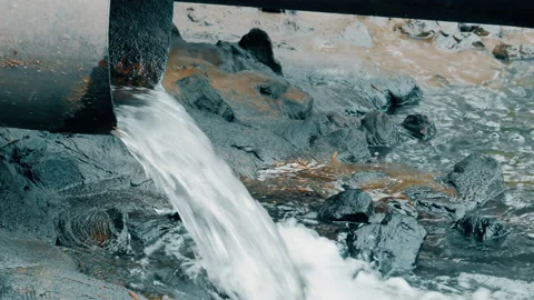 Close up of water gushing out of the pipe Stock Footage 89985194