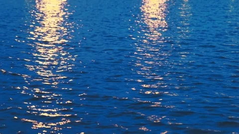 Close up of water pond surface during the night with reflection from city light Stock Footage 107432496