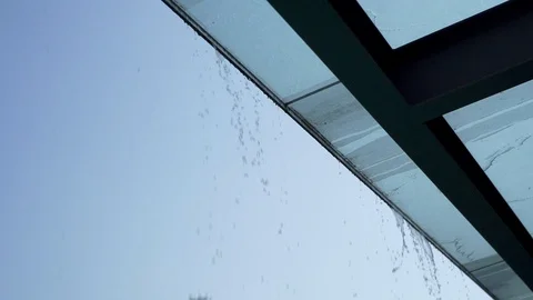 Close up of water pouring down from glass ceiling, Portugal Stock Footage 128965873