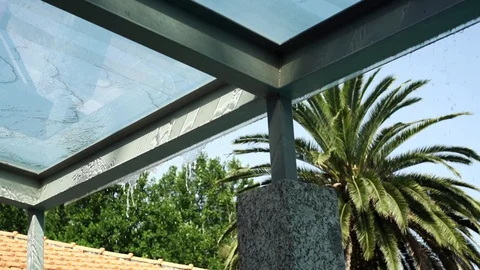 Close up of water pouring down from glass ceiling in slow motion, Portugal Stock Footage 128966166