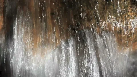 Close up of water pouring down a stream Stock Footage 132735181