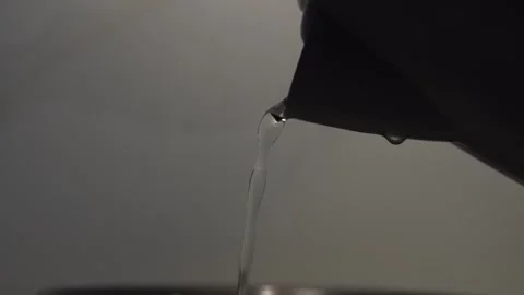 Close Up of Water Pouring from Kettle Spout Stock Footage 341802085