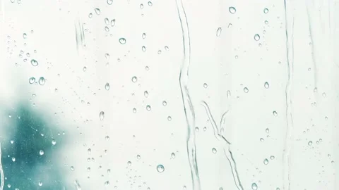 Close-up of water rain drops on window glass, Rain, Go Away. Large rain drops st Stock Footage 134179653