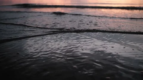 Close up of water rolling at the sunset Stock Footage 158456529