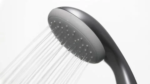 Close-up of water running from a shower head isolated on white background. Stock-Footage 234137384