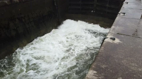 Close up of water rushing into the locks tilt up Stock Footage 143714203