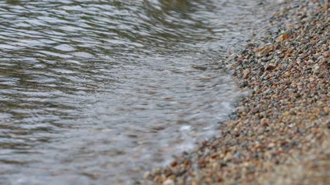 Close up Water on Shore of Mountain Lake with Little Pebbles  Stock Footage 249271953
