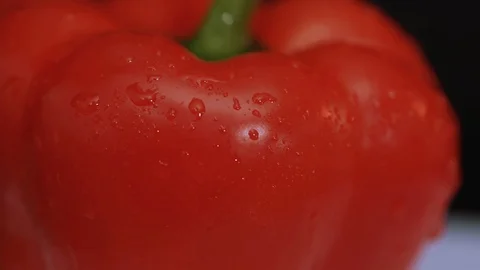 Close up water splash on fresh red peppers on white background scattering on Stock Footage 100306920
