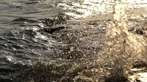 Close up of water spray hitting the edge of the lake Stock Footage 280688639