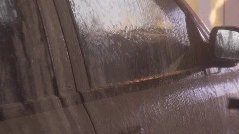 Close Up Water Sprays Side Of Red Car Car Wash Stock Footage 87888934