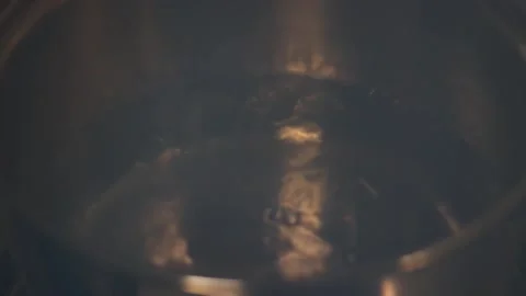 Close up of water in stainless pot being boil by gas stove with a lot of stream Video stock 158935656