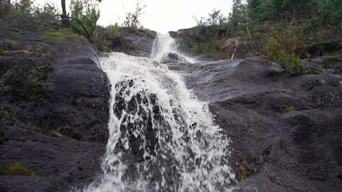 Close up of waterfall with black stone formations in slow motion, Portugal Stock-Footage 129067533