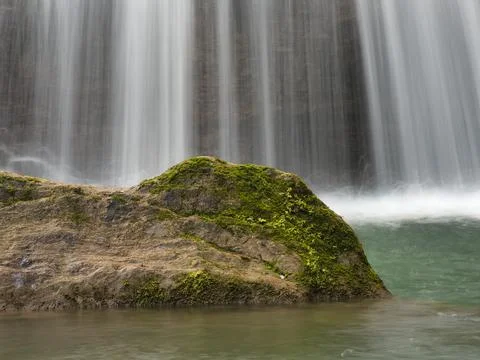 Close-up of Waterfall Cascading Down Rocks - Vertical shot using long expos.. Stock Photos