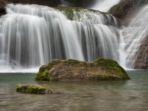 Close-up of Waterfall Cascading Down Rocks - Vertical shot using long expos.. Stock Photos