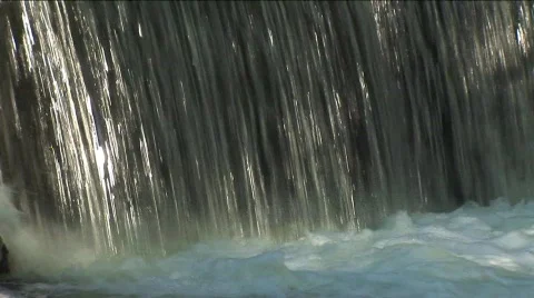 Close waterfall into creek Stock Footage 311902