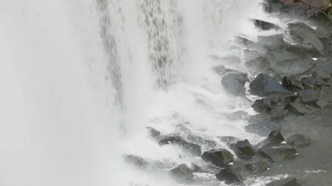 Close up of a waterfall from a dam on to the the rocks below 3. 4K locked tripod Stock Footage 148139046