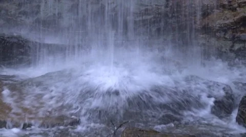 Close-up of a waterfall hits the stones Stock Footage