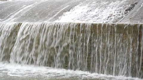 Close Up of Waterfall Layers on Urban Concrete Bank Stock Footage 310024401