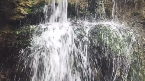 Close up of waterfall over mossy rocks Stock Footage 8519314