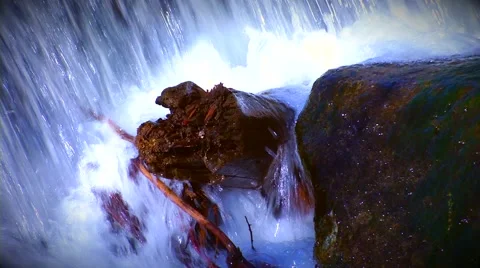 Close up of waterfall over wood Stock Footage 60796715