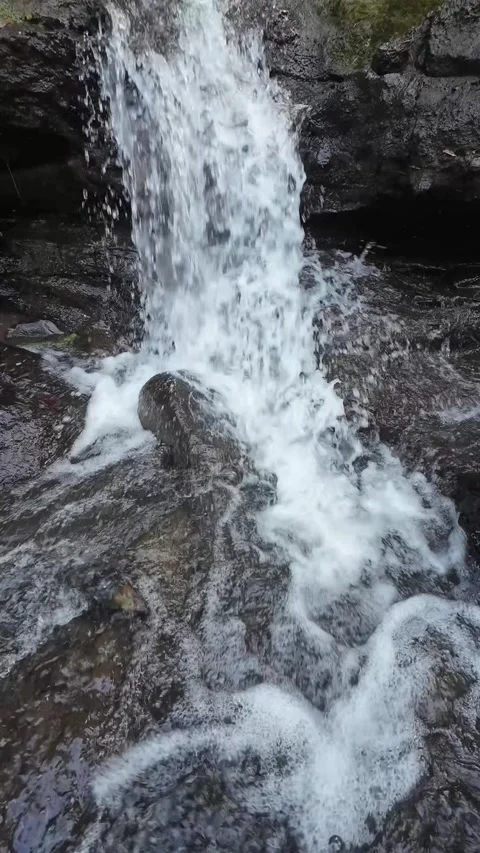 Close Up Waterfall Rushing Down Rocky Stream in Vertical 4K Stock Footage 336748509