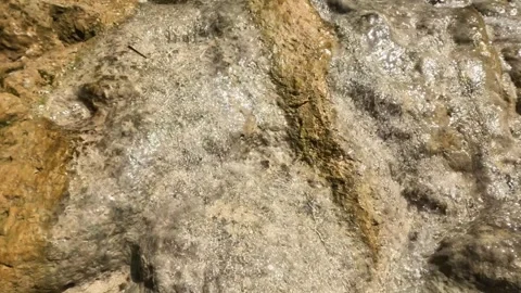 Close up of a waterfall with a small flow of water during the dry season Video stock 321321693