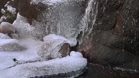 Close up of Waterfall in snow on River Coupall, Glen Etive Stock Footage 231176509